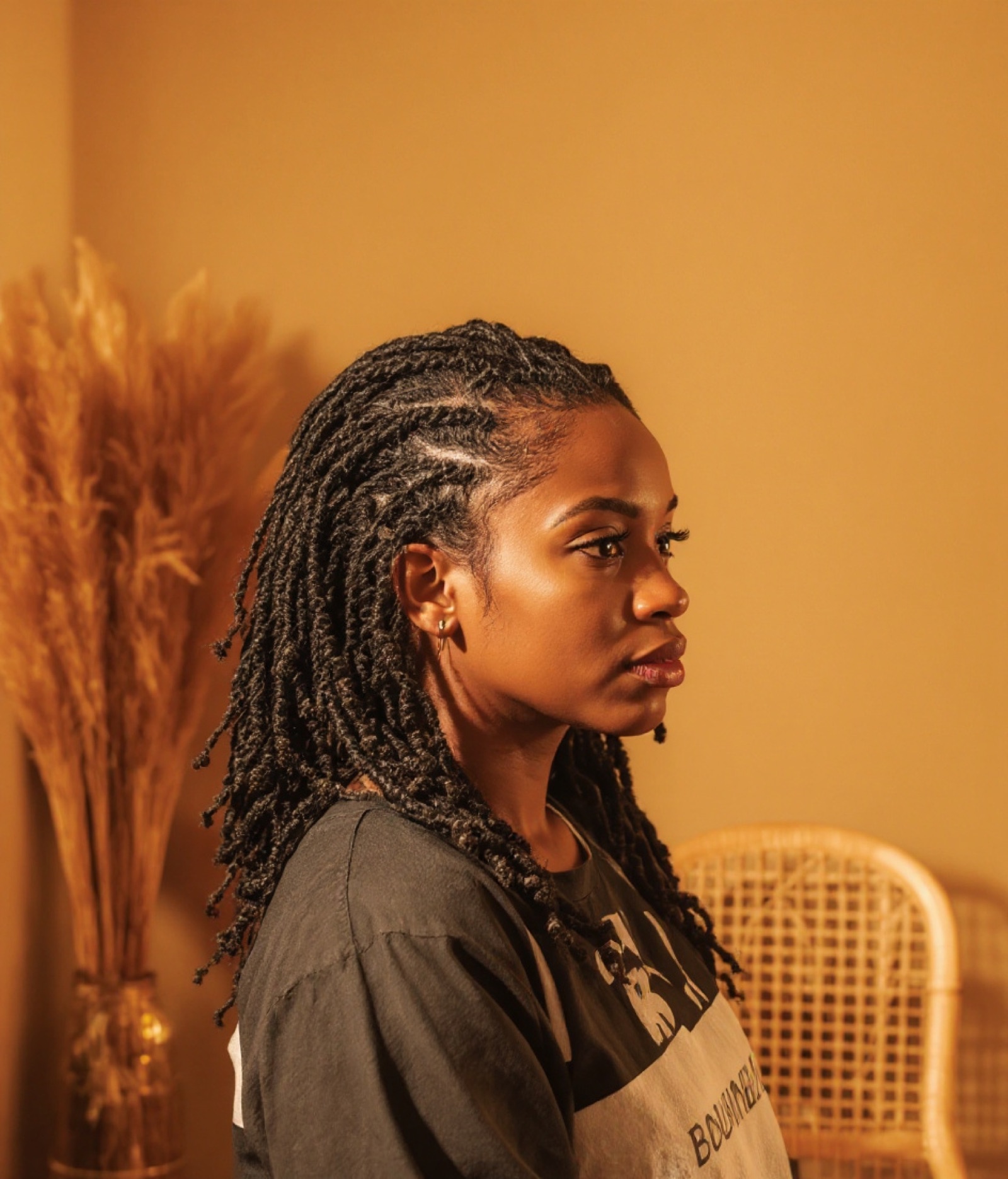 Distressed faux locs worn down, the same client after the install (sample result)