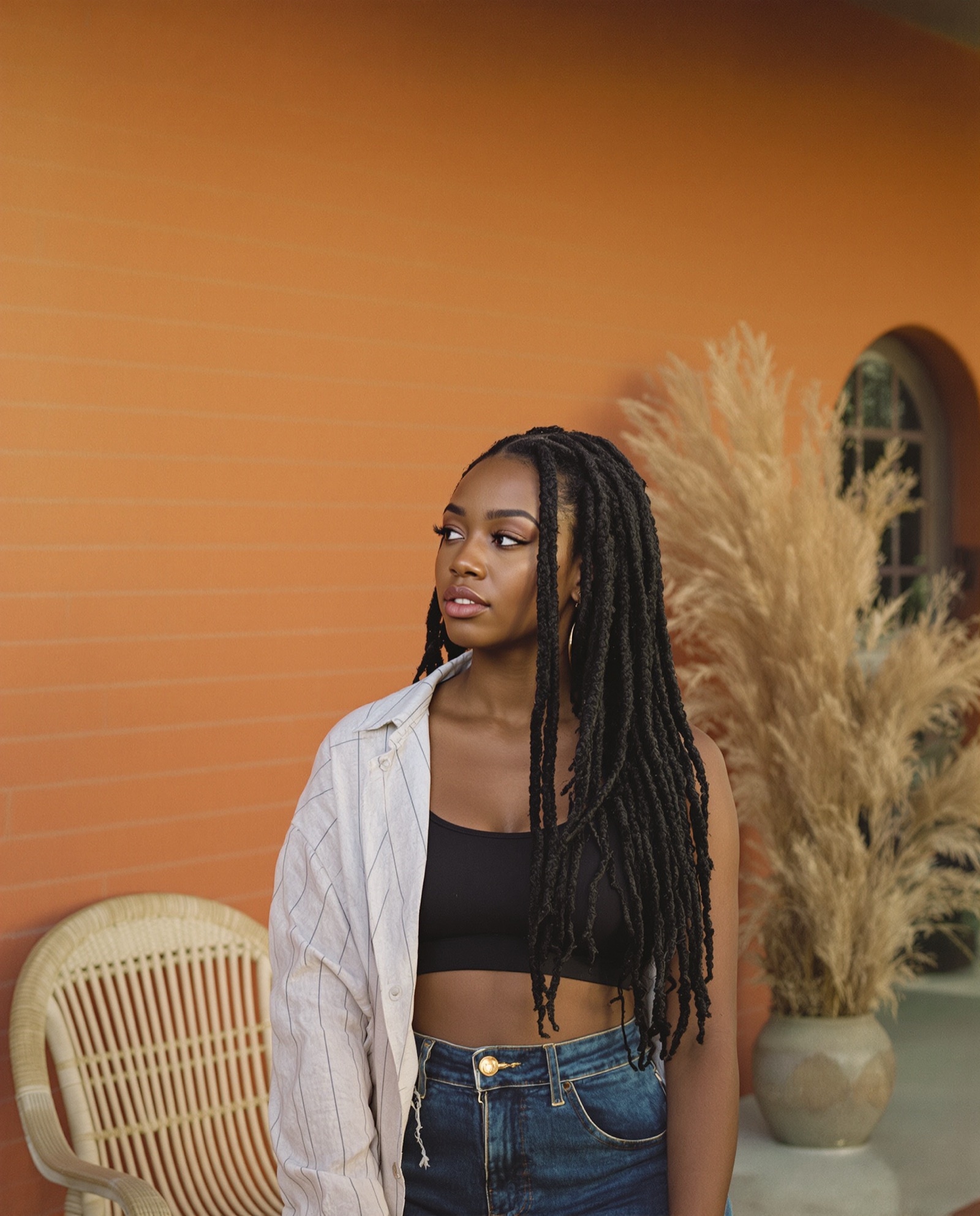 Distressed faux locs worn down, outdoors