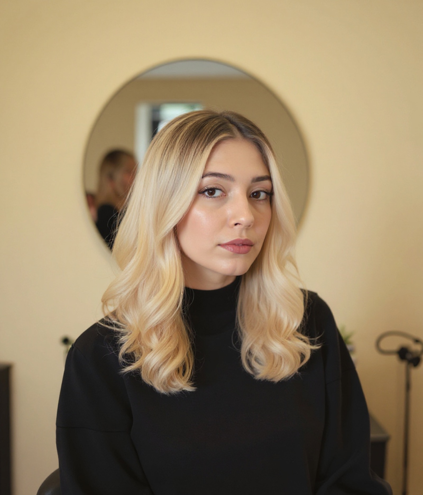 Bright honey-blonde balayage with face-framing pieces, the same client after (sample result)